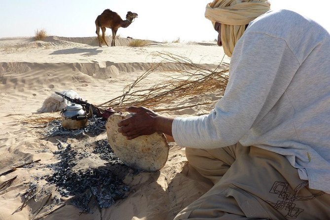 Camel ride and 1 night in the desert - A desert camp after sunset